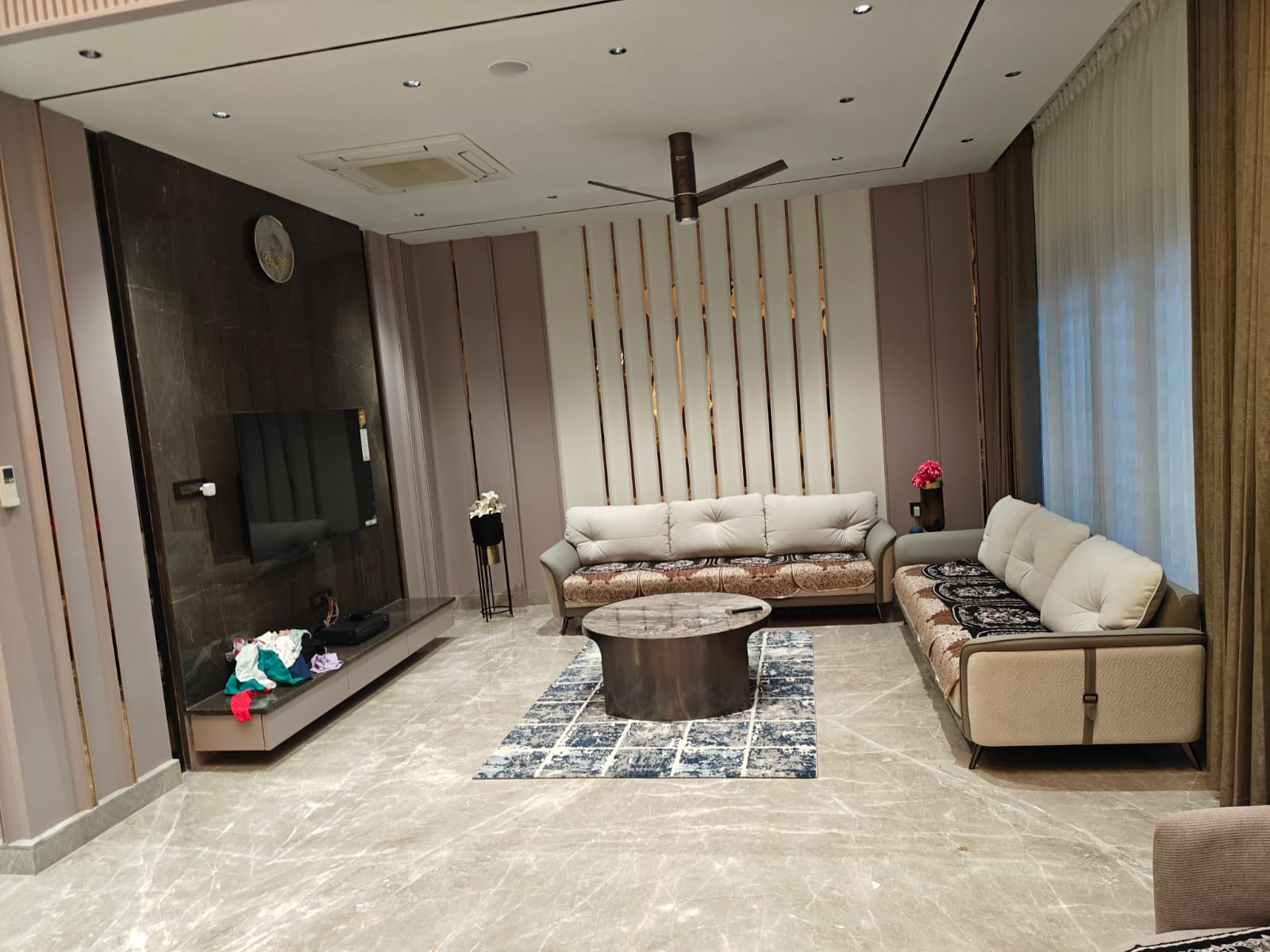 Anand portfolio — spacious living room with custom carpentry and high-quality interior execution by Aasva